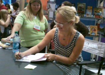 author happy to sign a book